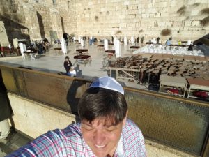 Wearing Jewish yamaka to enter the sacred holy space at the Western Wall of the Second Temple in the Old City of Jerusalem.